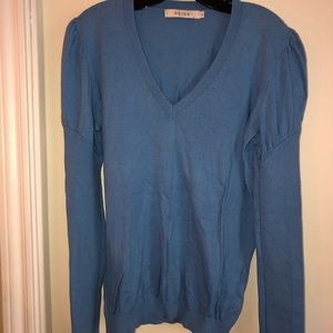 Reid’s light sweater